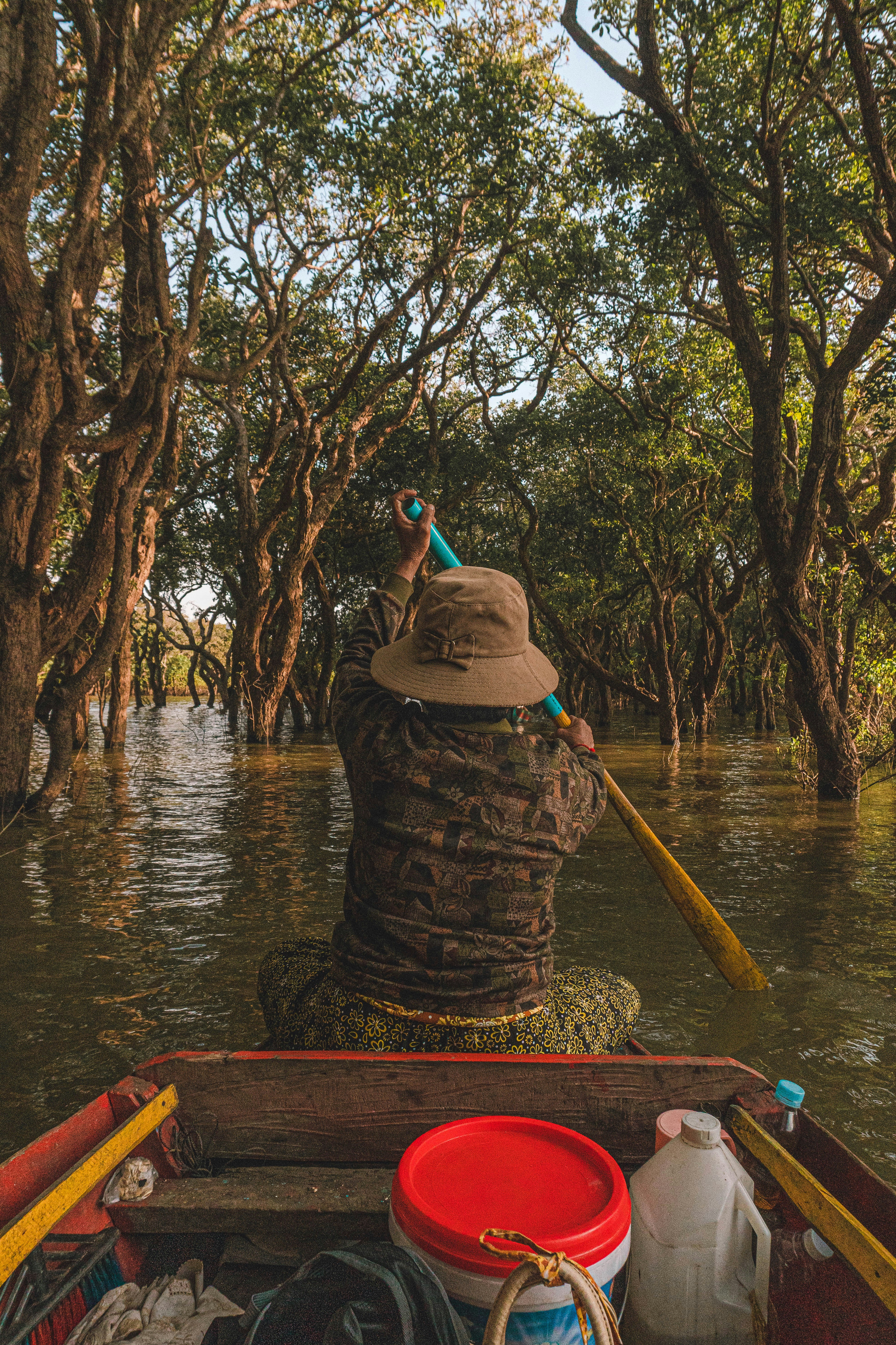 a person riding in a boat on a river