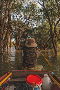 a person riding in a boat on a river