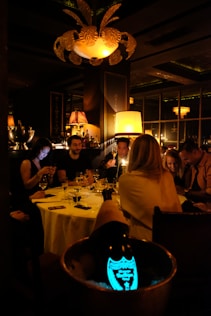 a group of people sitting at a table in a restaurant