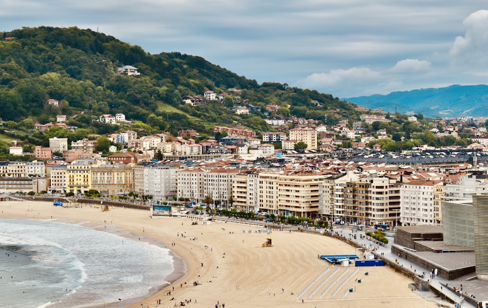 a view of a beach with a city in the background