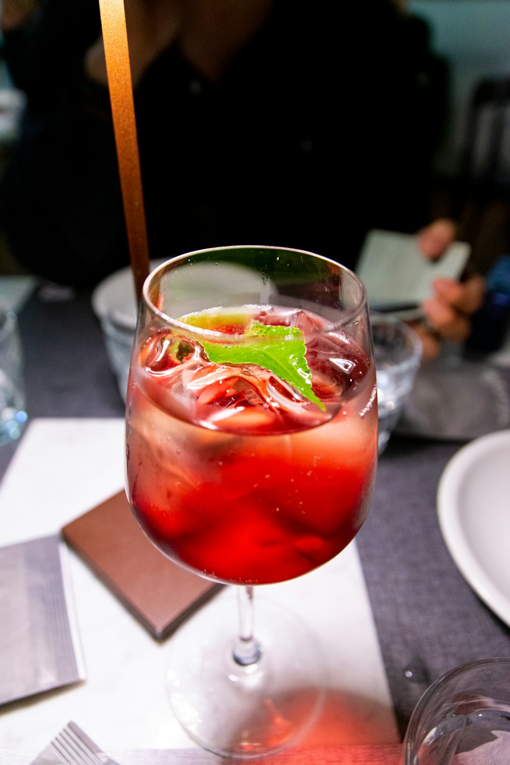 a close up of a wine glass on a table