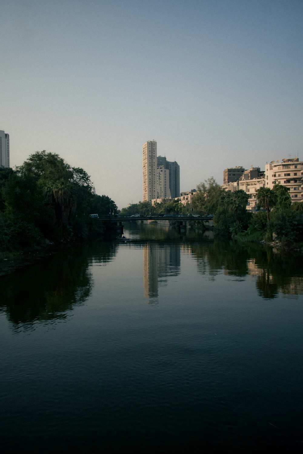 a body of water surrounded by tall buildings