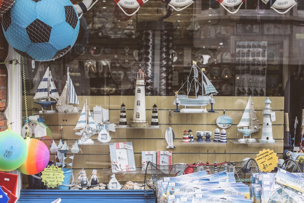 a window display with a soccer ball and other items