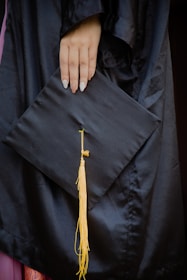 A close-up of hands holding a nursing diploma.