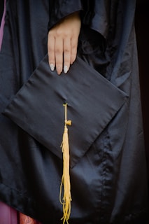 A close-up of hands holding a nursing diploma.