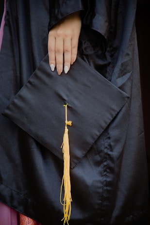 A close-up of hands holding an admission letter with the eduvance logo visible.
