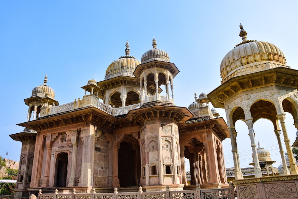 a large building with a lot of pillars and domes