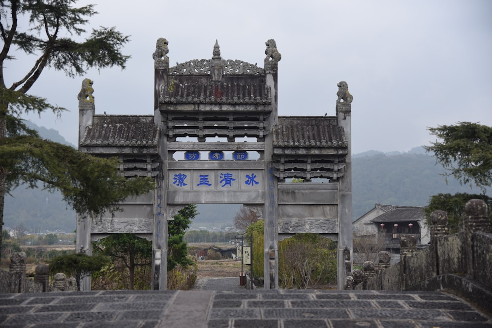 a large gate with statues on top of it