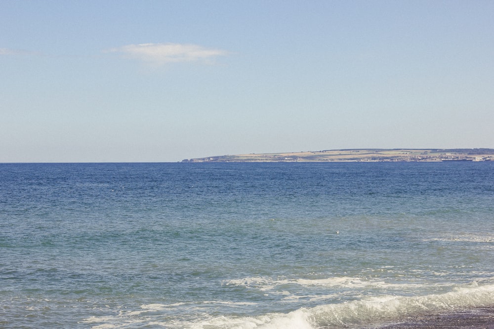 a person riding a surf board on a body of water