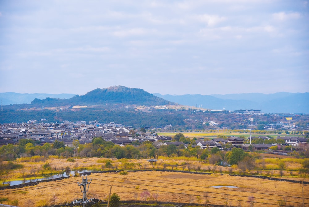 a view of a city with mountains in the background