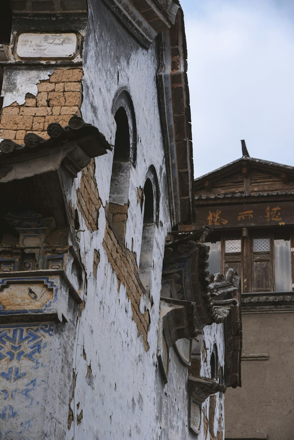 an old building with a clock on the side of it