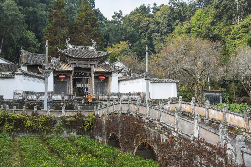 an old building with a bridge in front of it