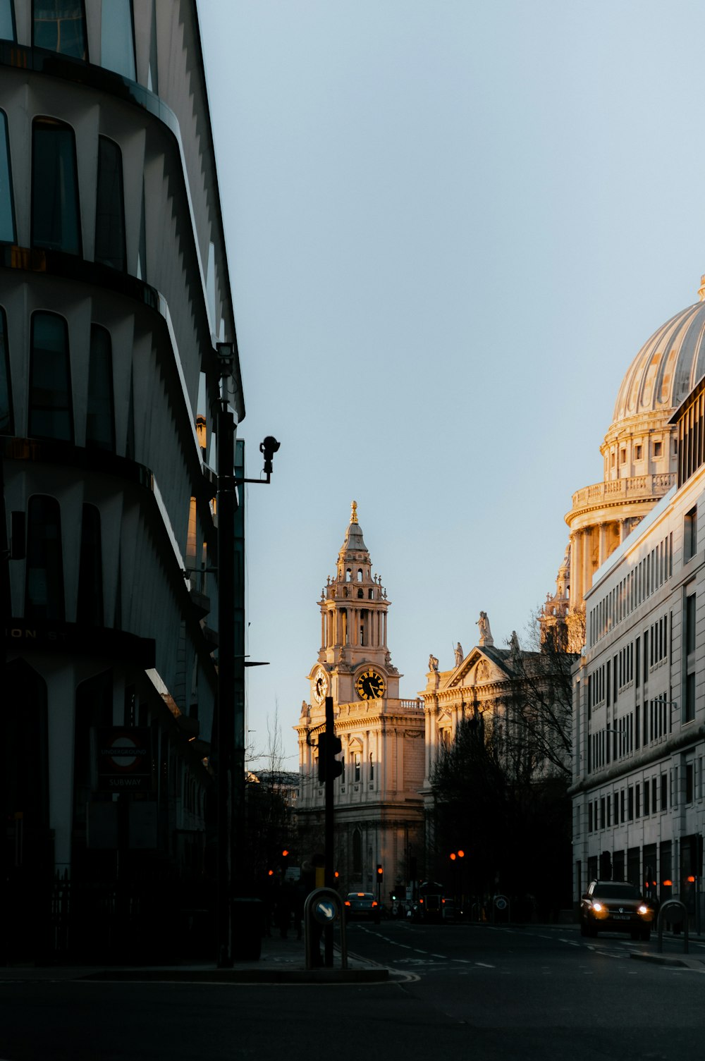 a view of a city street with a building in the background