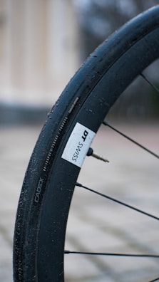 Close-up of a tire valve and inner tube ready for installation.