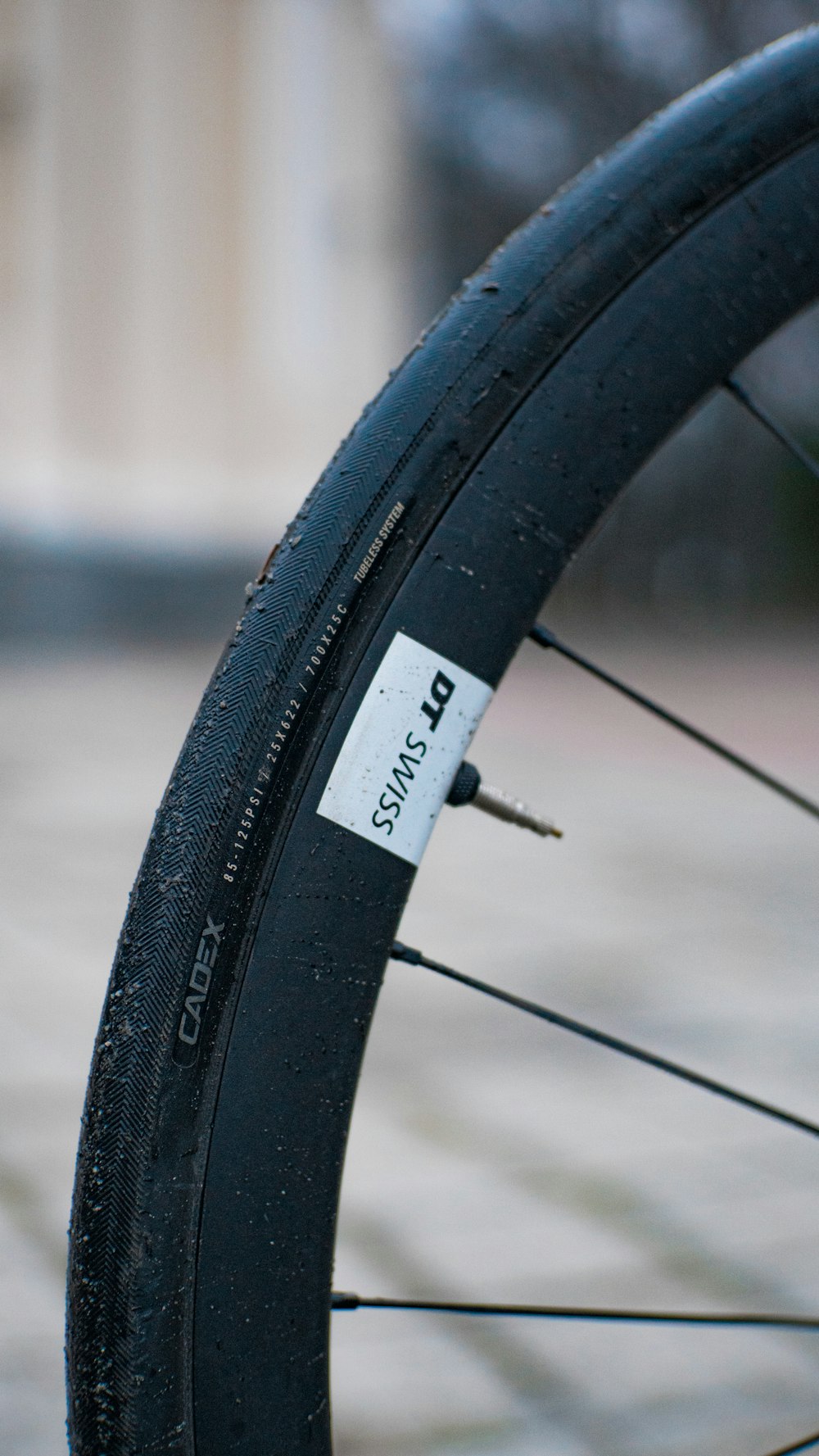 a close up of a bike tire with a sticker on it