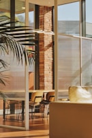 Interior rendering showing a spacious living room with modern furnishings and natural light.