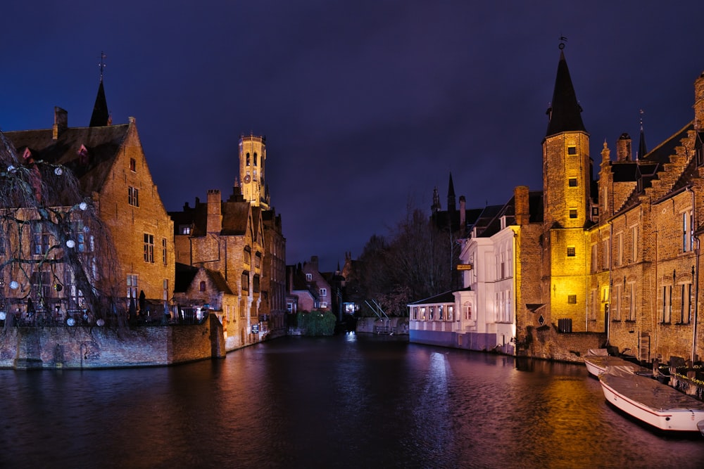 a river running through a city next to tall buildings