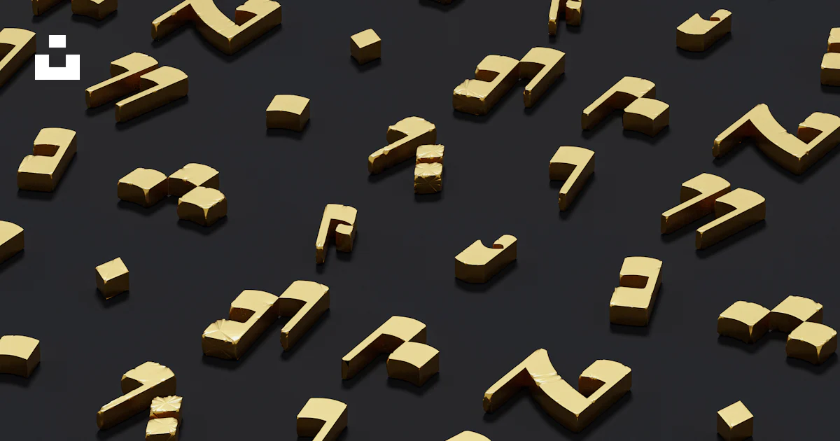 A group of gold letters and numbers on a black surface photo – Free ...