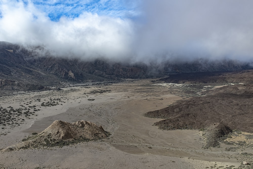 a view of a mountain range with a river running through it