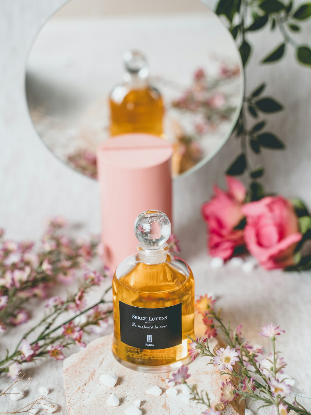 a bottle of perfume sitting on top of a table