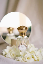 a bottle of perfume sitting on top of a table