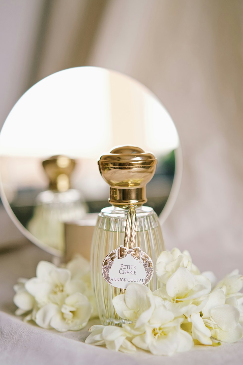 a bottle of perfume sitting on top of a table