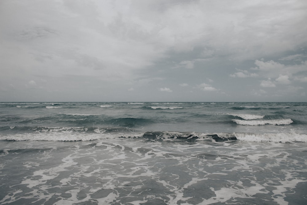 a black and white photo of the ocean