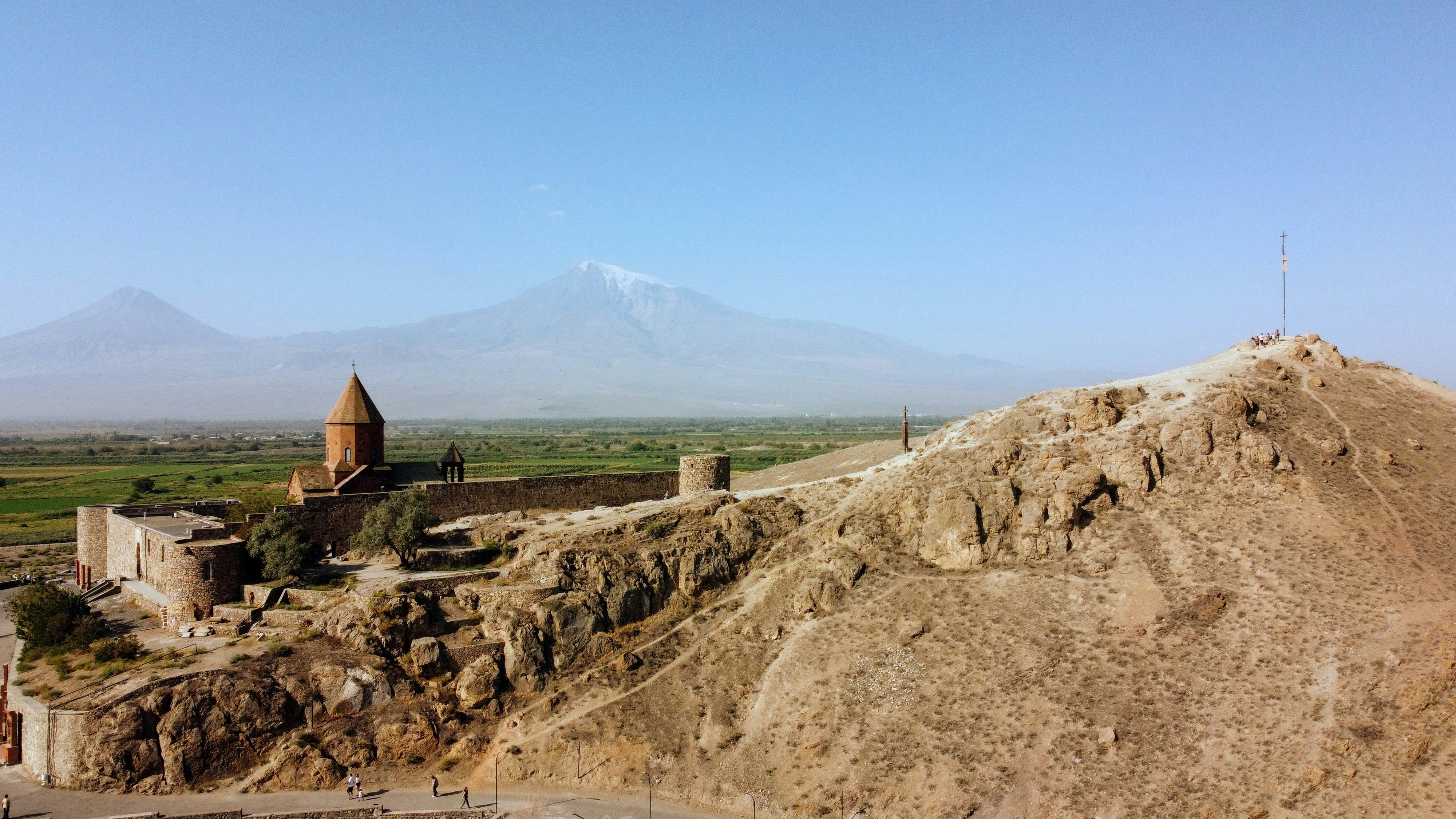a large hill with a building on top of it