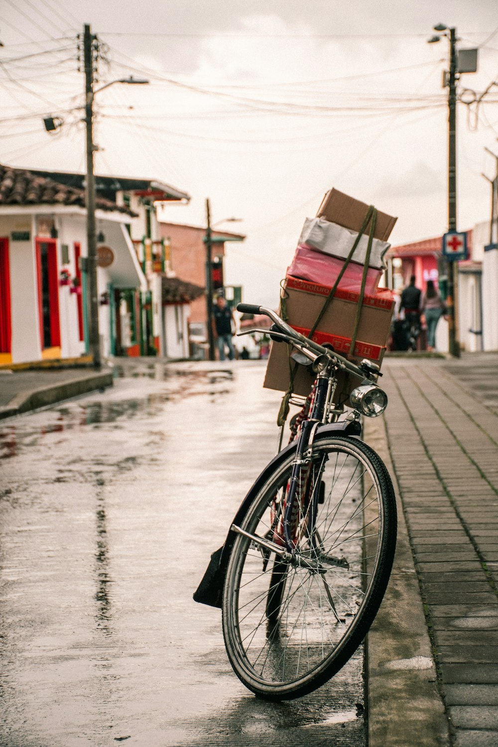 a bicycle parked on the side of the road