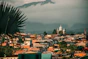 a view of a city with a mountain in the background