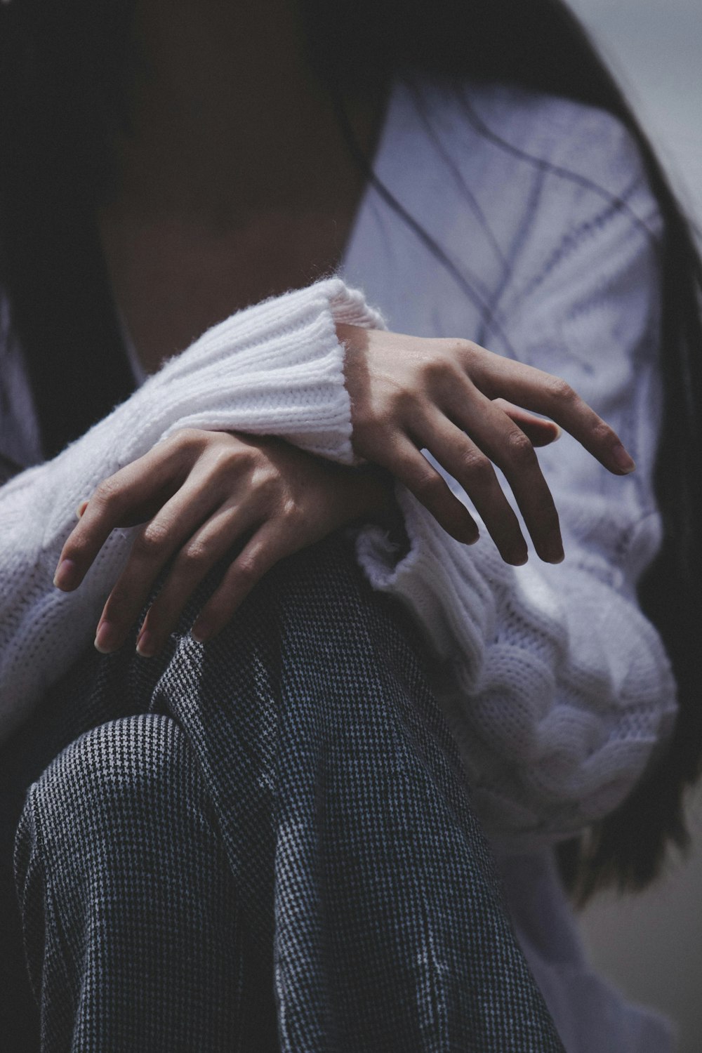 a woman with her hands on her knees