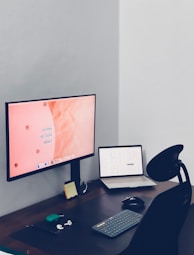 a desktop computer sitting on top of a wooden desk
