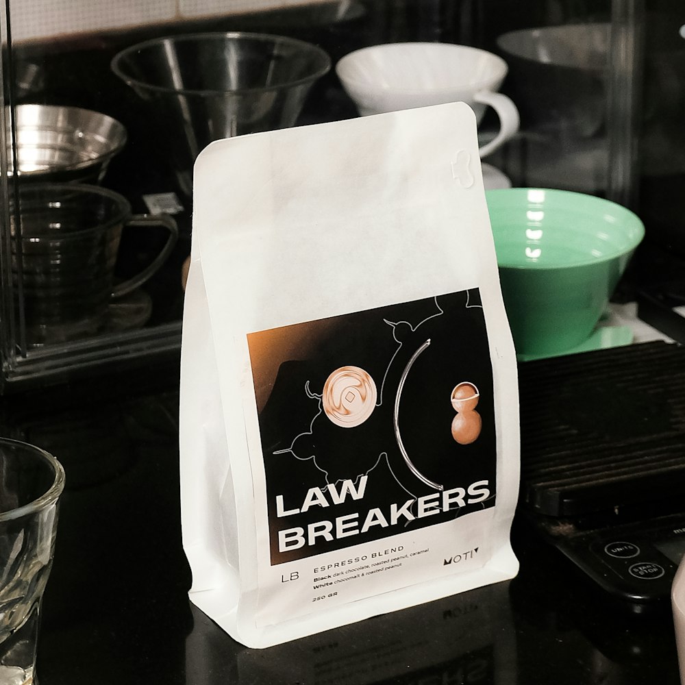 a bag of law breakers coffee sitting on a counter