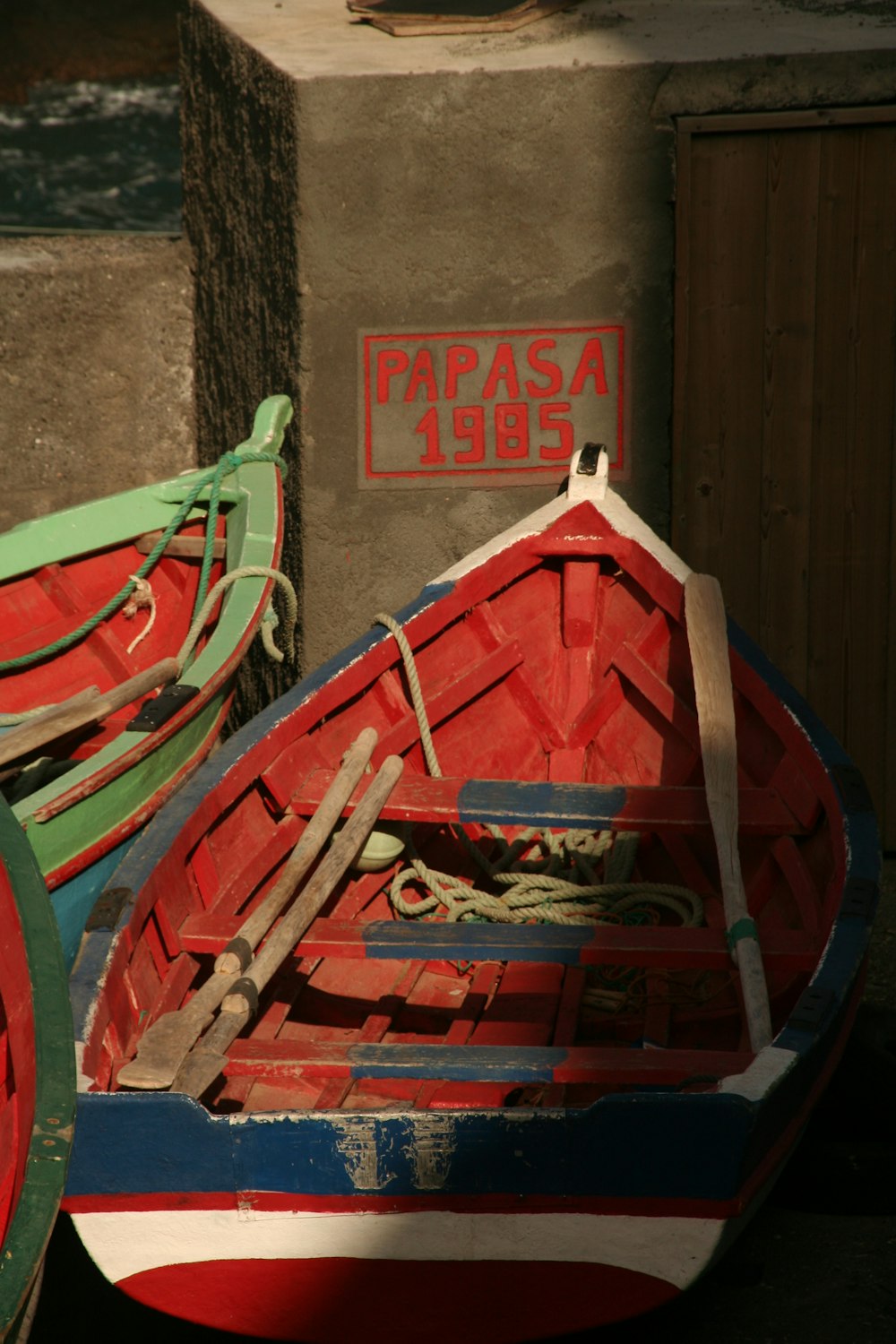 a couple of small boats sitting next to each other