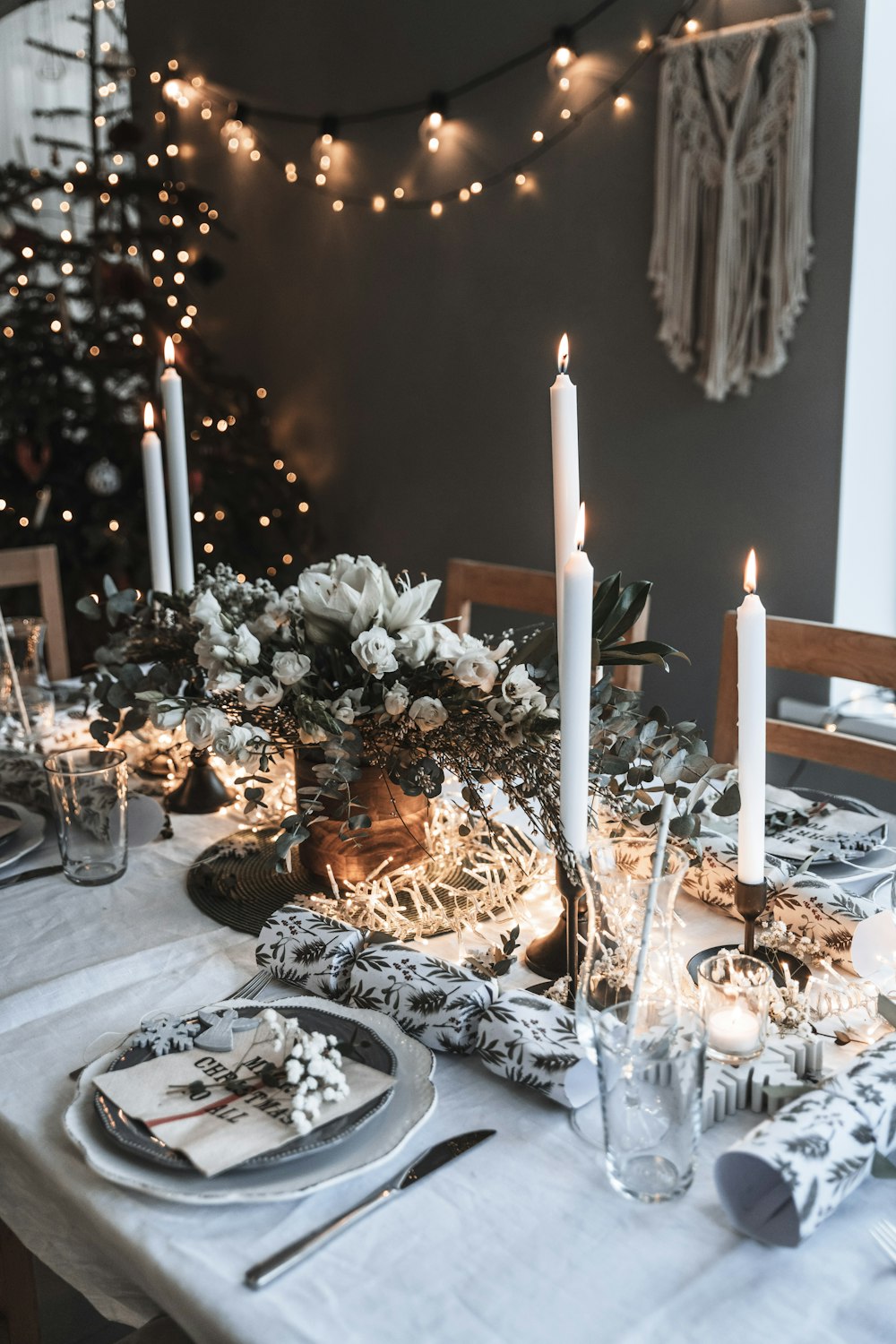 a table with a white table cloth and candles