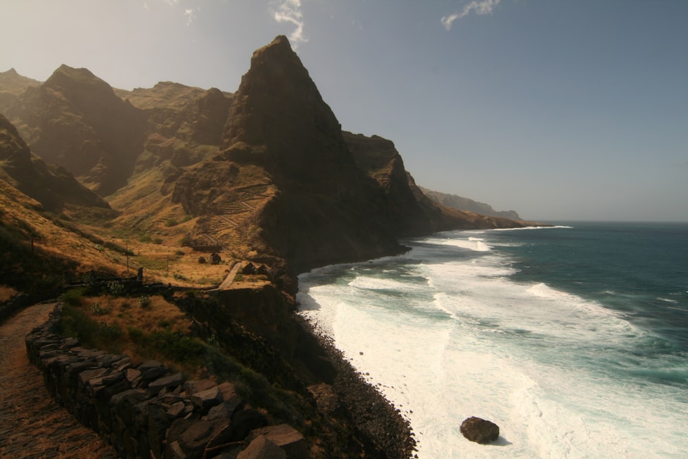 a scenic view of the ocean and mountains