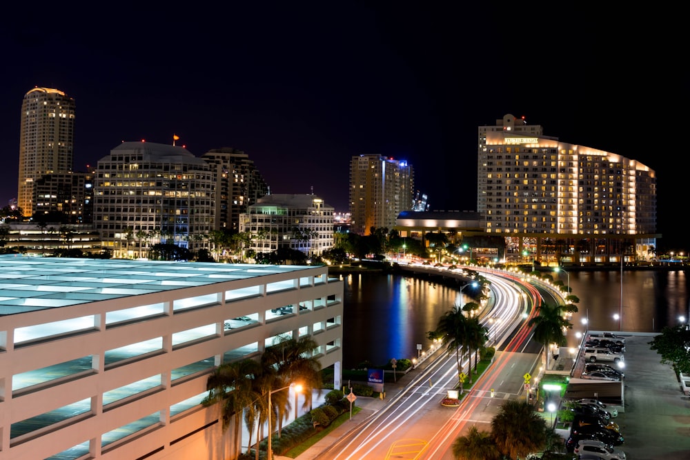 a view of a city at night from across the street