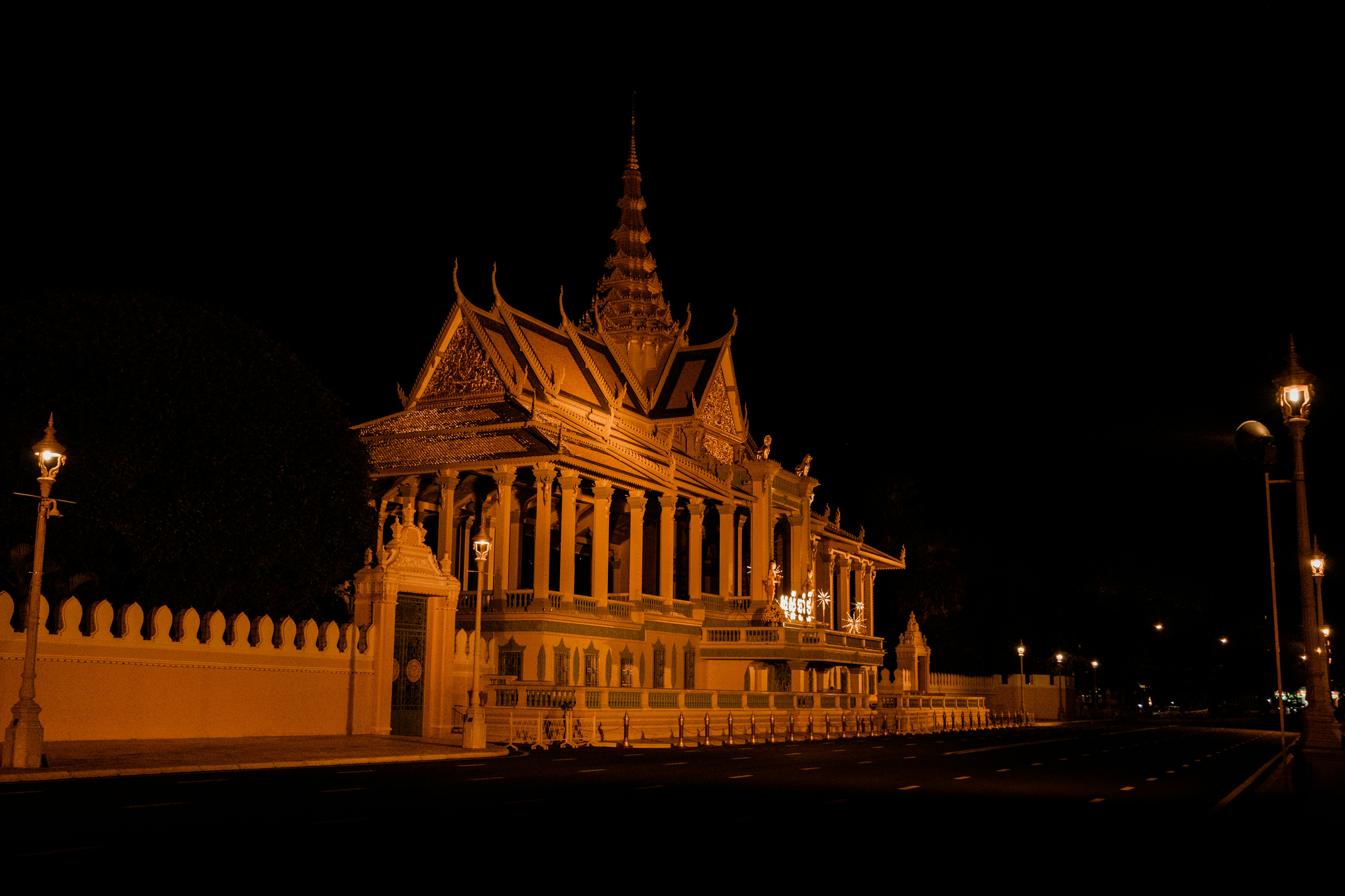 a large building with a clock tower at night