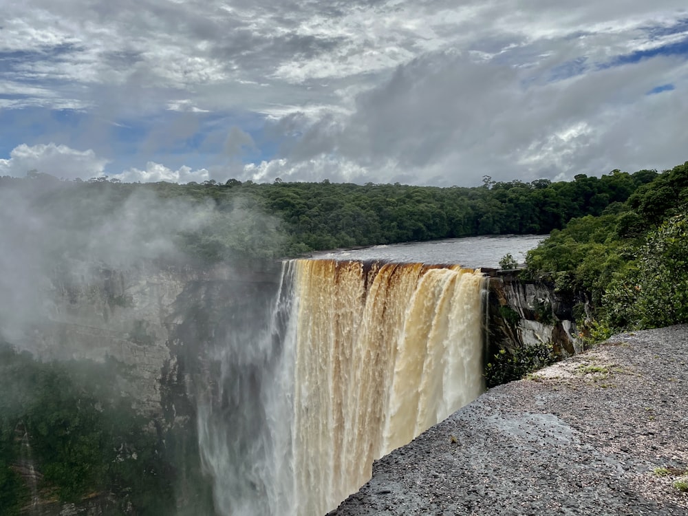 a large waterfall with water pouring out of it