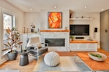 a living room filled with furniture and a fire place