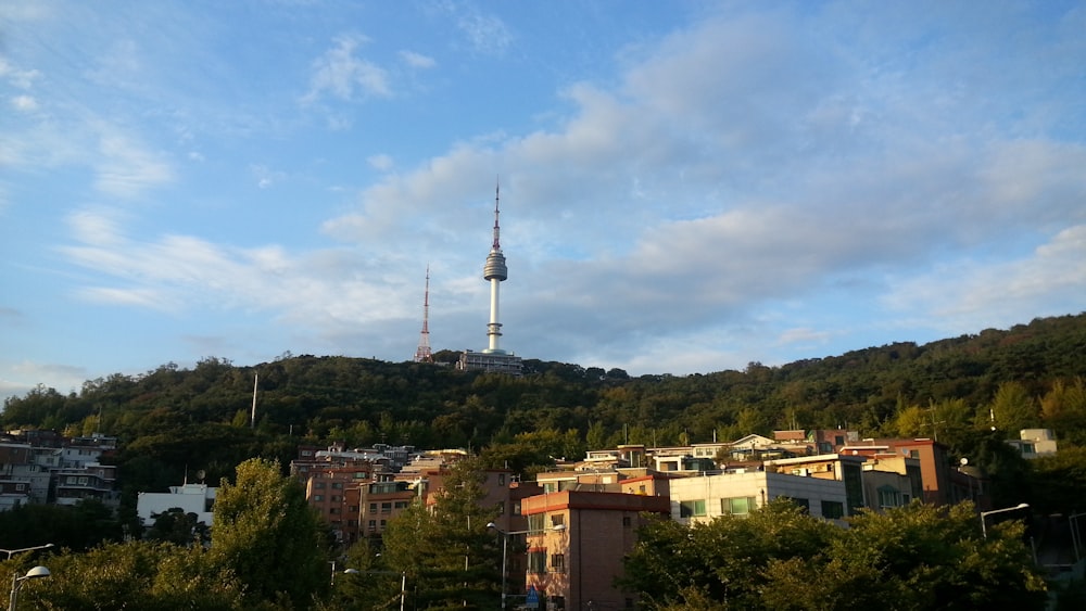 a view of a city with a tower in the background