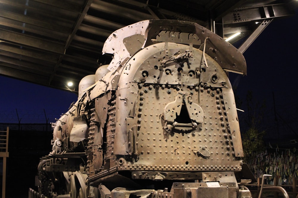 a large train engine sitting on top of a train track