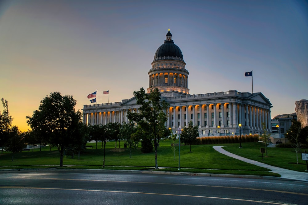 a large white building with a flag on top of it