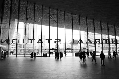 Modern commercial container space with large glass windows and golden accents.