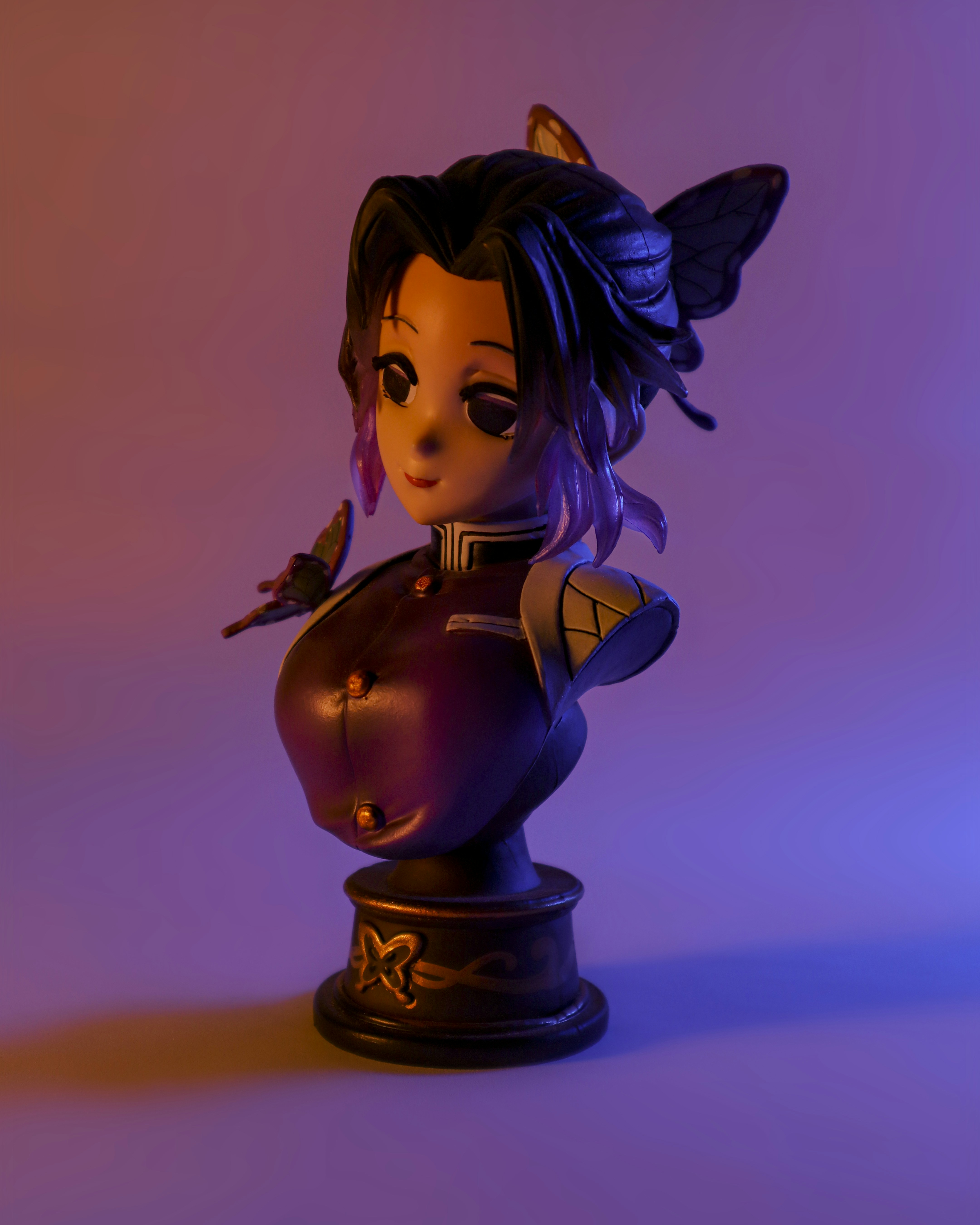 a figurine of a girl with a bird on her shoulder