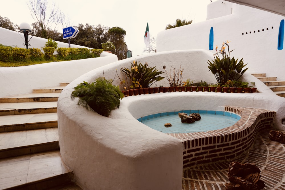 a hot tub in the middle of a courtyard