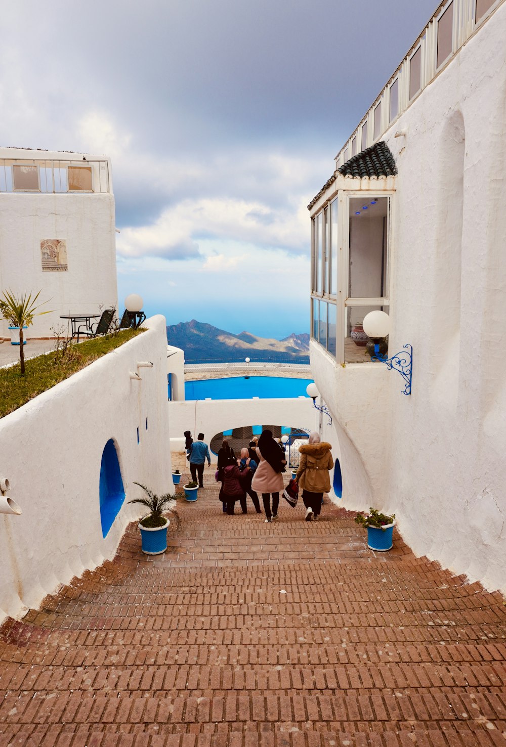 a group of people walking up a set of stairs