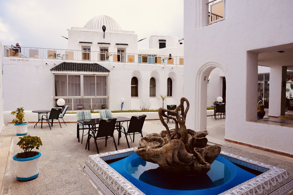 a fountain in the middle of a patio area