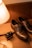 A pair of polished leather dress shoes displayed on a wooden surface.