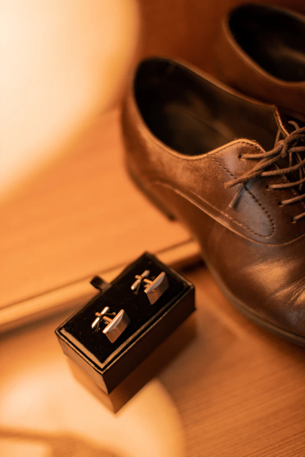 a pair of shoes and a box on a table
